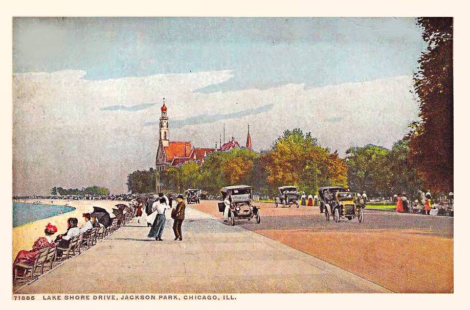 POSTCARD - CHICAGO - JACKSON PARK - LAKE SHORE DRIVE - LOOKING S GROUND LEVEL PEDESTRIANS SEATED ON BENCHES TOWARDS LAKE - SOME CARS - GERMAN BUILDING FROM WORLD'S FAIR IN BACKGROUND - TINTED - 1910s