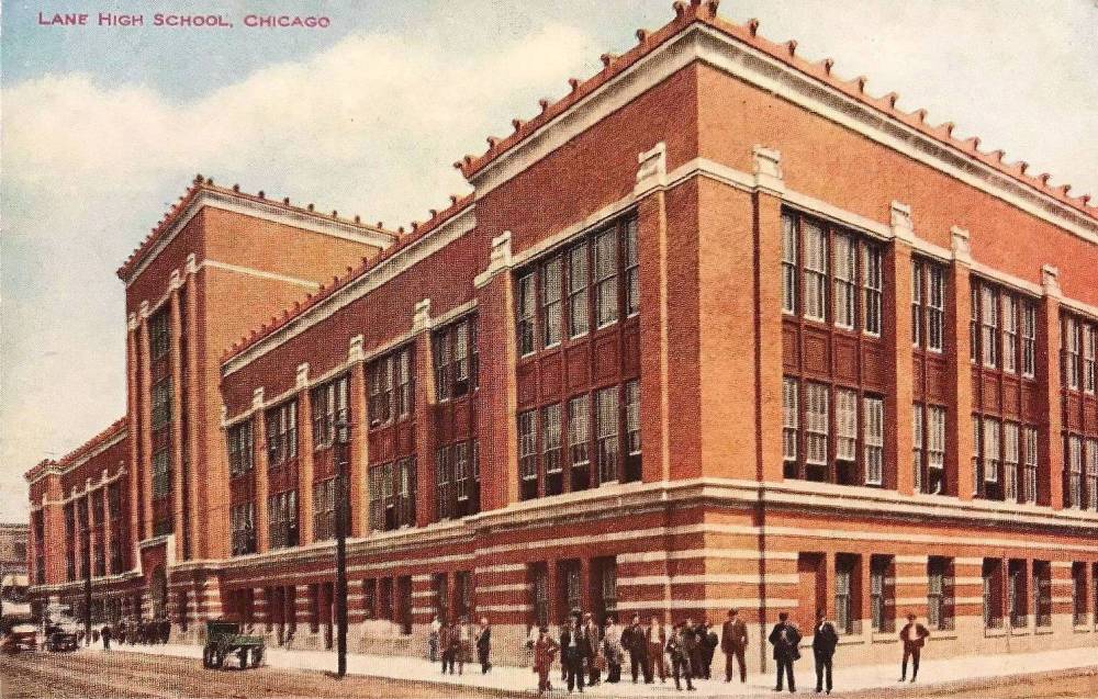 POSTCARD - CHICAGO - LANE HIGH SCHOOL - DIVISION AND SEDGWICK - STREET LEVEL THREE-QUARTER VIEW - CROWD OF PEOPLE IN FRONT- OPENED 1908 -TINTED - c1910