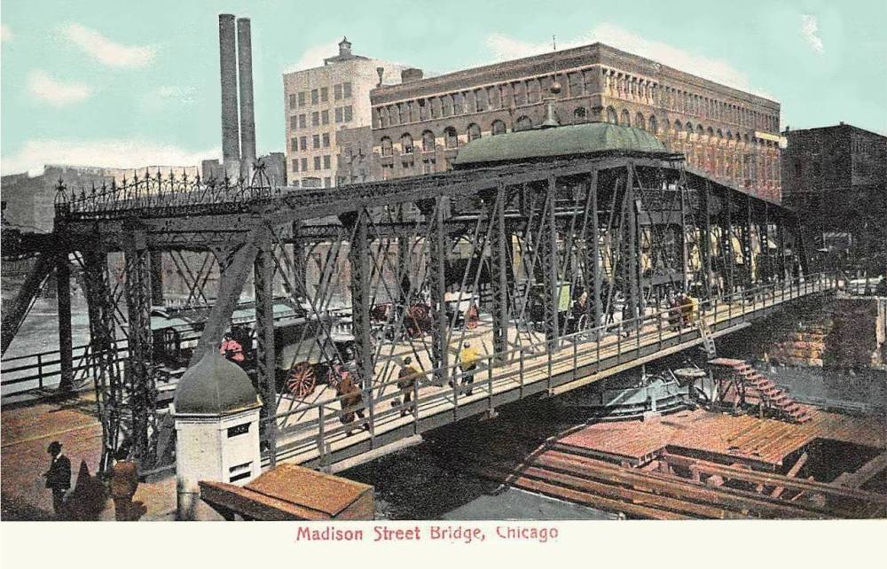A POSTCARD - CHICAGO - MADISON STREET BRIDGE - SLIGHTLY ELEVATED - CROWDED WITH PEOPLE WAGONS HORSES - NOTE THE BRIDGE-TURNING STRUCTURE RIGHT BOTTOM IN THE RIVER - TINTED - 1906